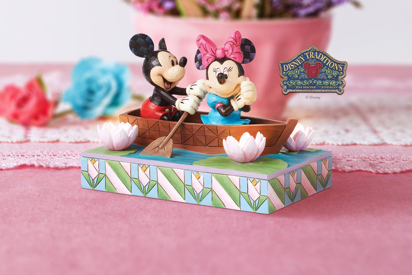 Mickey Mouse and Minnie Mouse in rowboat