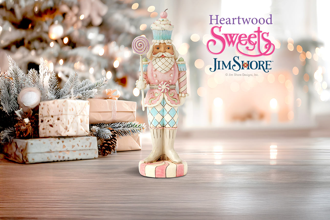 Decorative nutcracker figurine with 'Heartwood Sweets Jim Shore' branding in a festive setting.