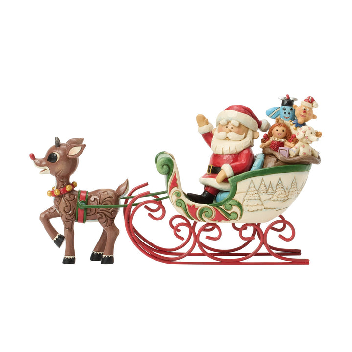 Rudolph Pulling Santa in Sled