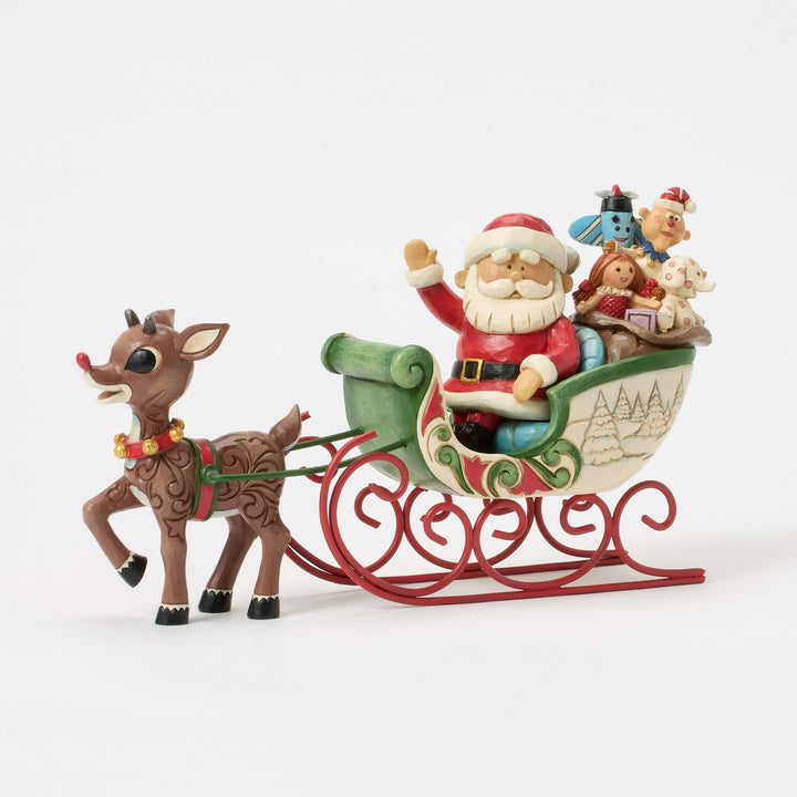 Rudolph Pulling Santa in Sled