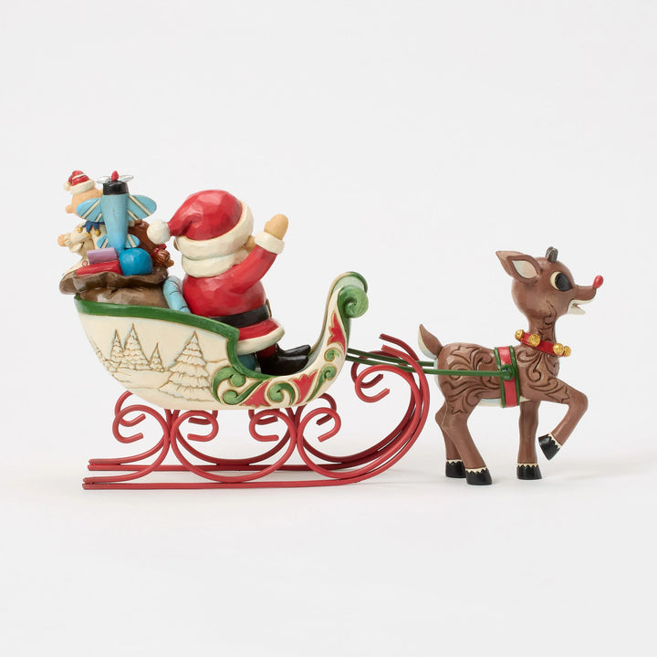 Rudolph Pulling Santa in Sled