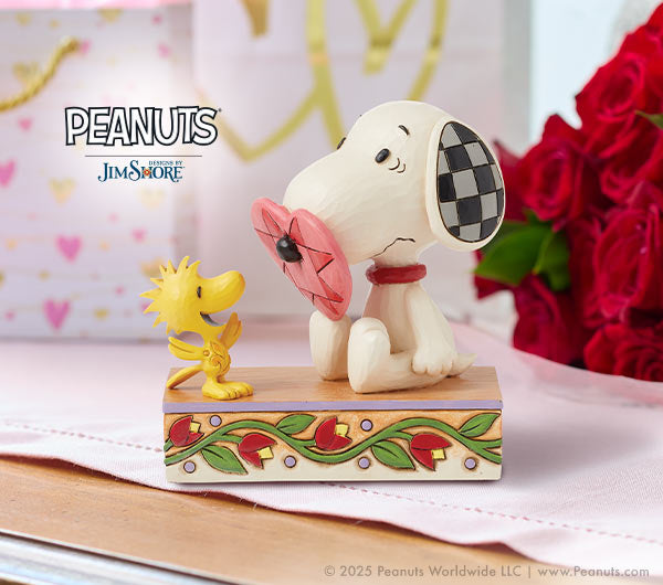 snoopy figurine with heart on nose