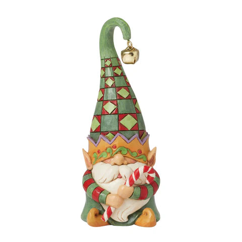 Green gnome holding candy cane figurine